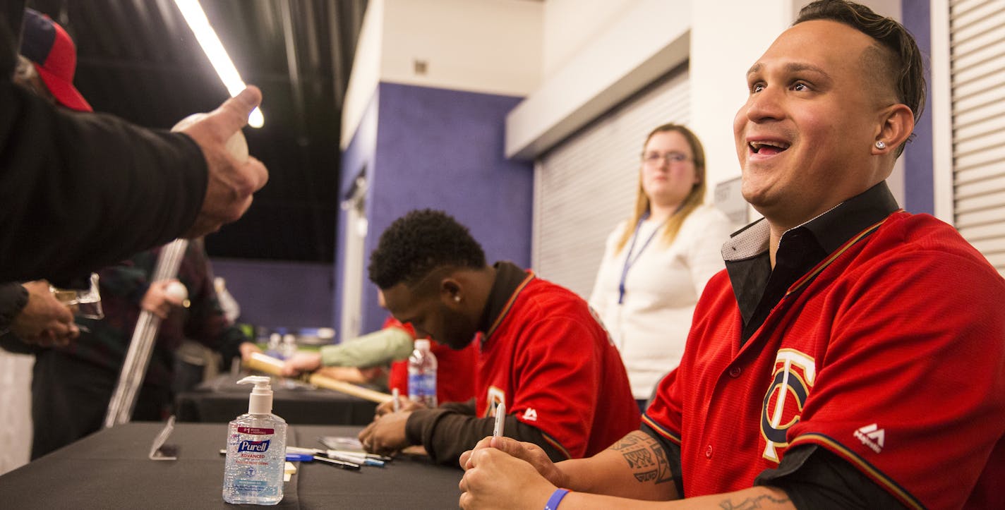 Twins player Oswaldo Arcia talks with a fan during TwinsFest at Target Field in Minneapolis on January 29, 2016. ] (Leila Navidi/Star Tribune) leila.navidi@startribune.com