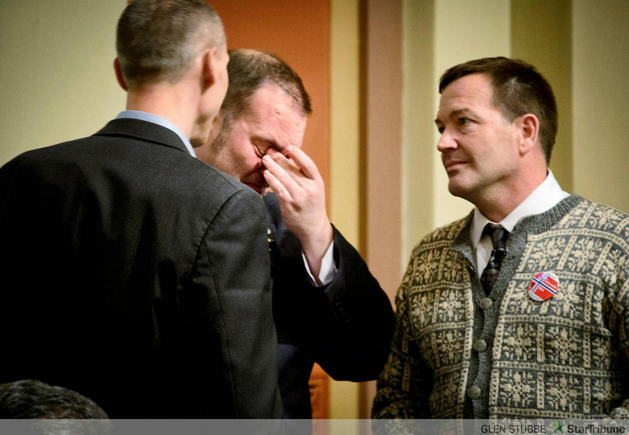 Rep. Dan Schoen was brought to tears after the medical marijuana bill passed the House.  On the left is Rep. Rod Hamilton and right,  Rep.  Leon Lillie, all supporters of the medical marijuana bill.     ]     Friday, May 16, 2014   GLEN STUBBE * gstubbe@startribune.com