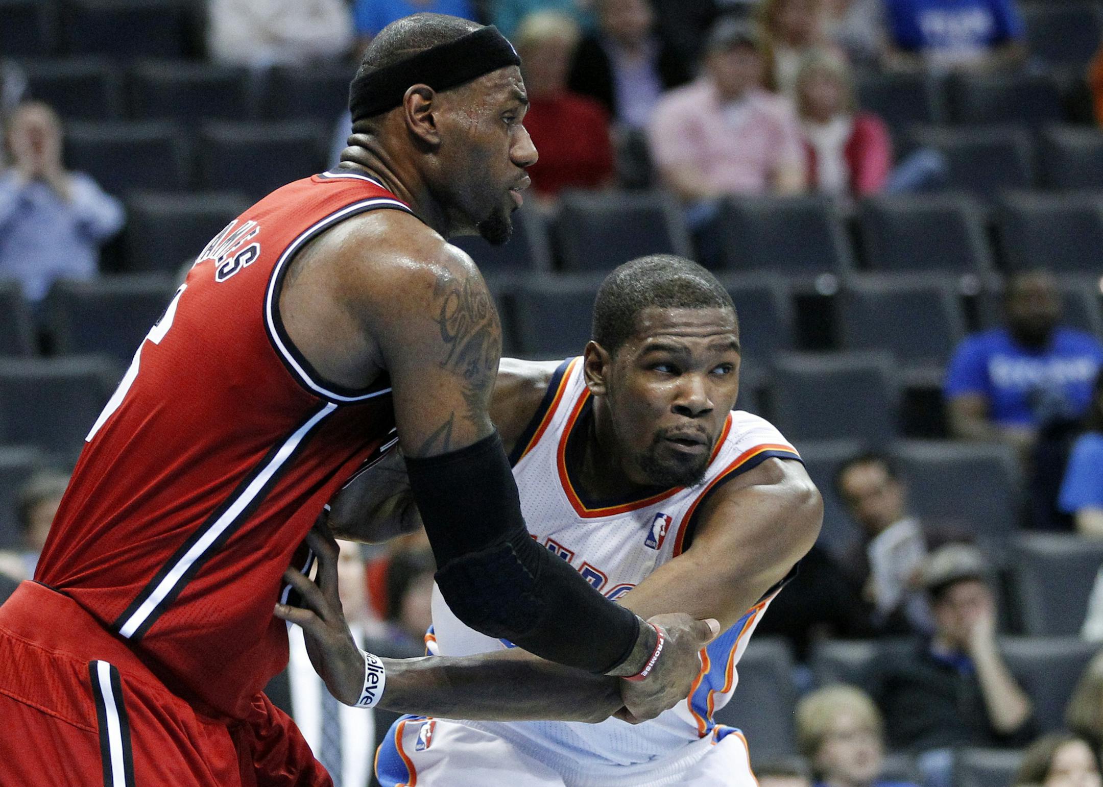 FILE - In this Feb. 14, 2013, file photo, Miami Heat forward LeBron James (6) and Oklahoma City Thunder forward Kevin Durant (35) battle for position during an NBA basketball game in Oklahoma City. It's a matchup of perhaps the best two players in the NBA, when James and Durant square off on Wednesday night, Jan. 29, in Miami. (AP Photo/Sue Ogrocki, File)