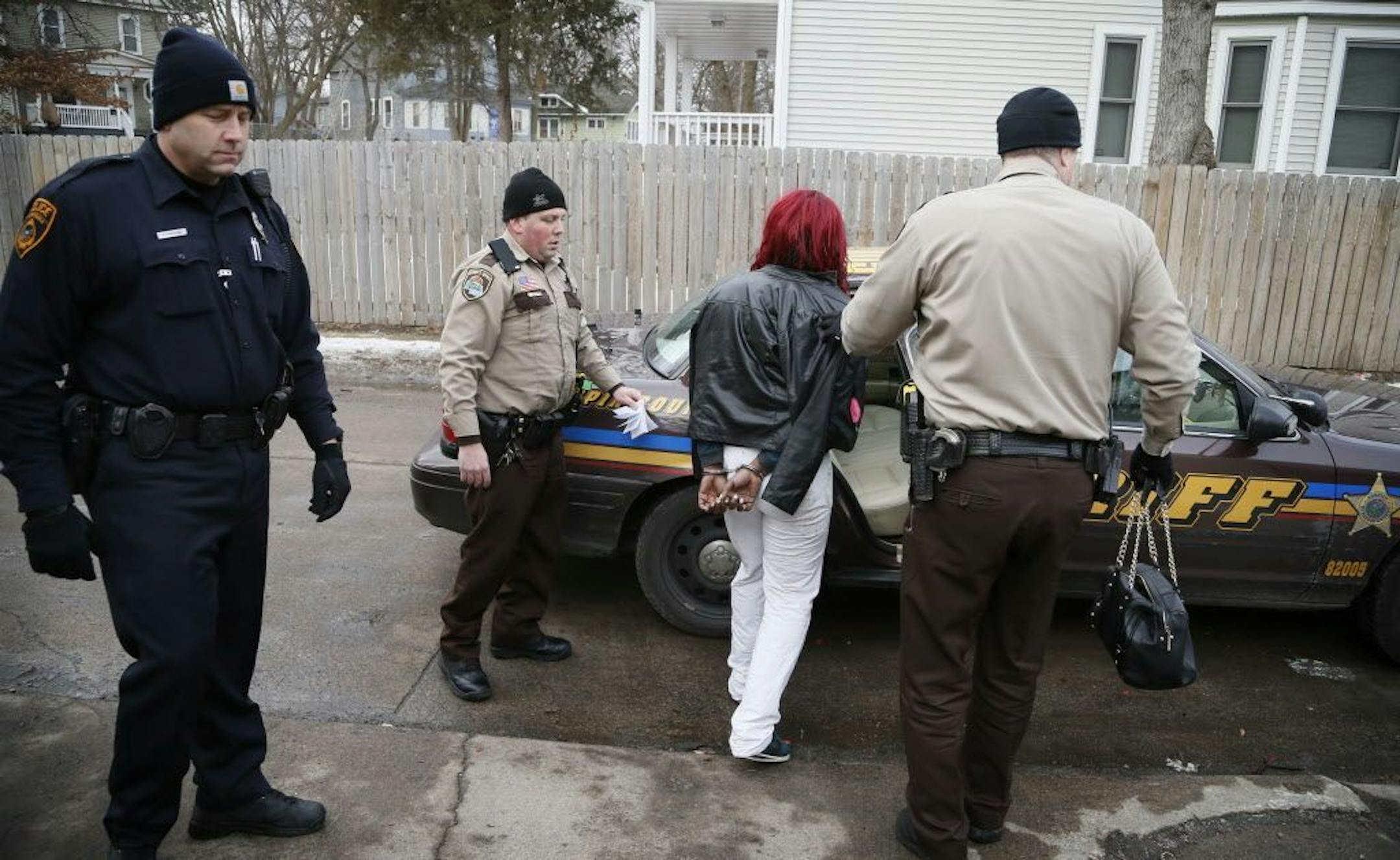 Members of the Hennepin County Sheriff's Office and the Minnetonka and Deephaven police departments arrested a fugitive near Humboldt Avenue N. and 25th Avenue N. in Minneapolis on Thursday, Jan. 28, 2015. There was a warrant for the suspect on a charge of criminal sexual conduct.