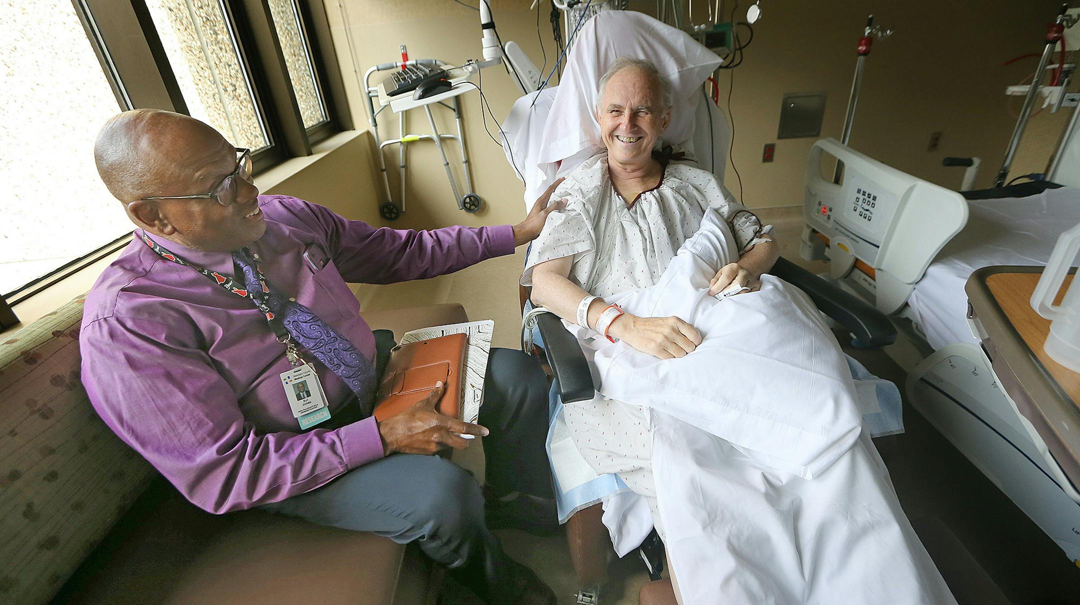 HCMC patient and Jehovah's Witness Minister Michael K. Anderson, who underwent a bloodless emergency bypass procedure after a heart attack, was visited by fellow Jehovah's Witness and HCMC Administrative Resident/Fellow Syl Jones in his hospital room, Tuesday, September 14, 2016 in Minneapolis, MN. HCMC in Minneapolis has made blood surgery part of its patient order set, meaning it is considered for every patient as part of initial screening. Bloodless surgery is an increasing practice as hospit