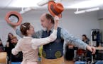 Kimberly Richardson and Jim Lichtscheidl dance in a scene from Lauren Yee's "The Hatmaker's Wife," directed by Joel Sass for Ten Thousand Things Theat
