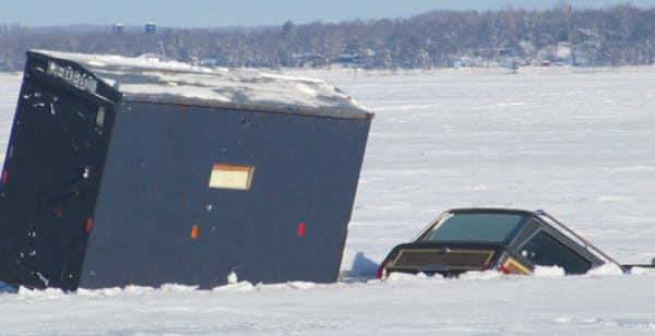 This truck and ice fishing house went through the ice last week on Lake Ida in Douglas County. No one was hurt. DNR photo