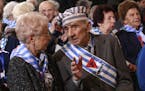 Holocaust survivors attend a ceremony at the former Auschwitz Nazi death camp in Oswiecim, Poland, Wednesday, Jan. 27, 2016, the 71st anniversary of t
