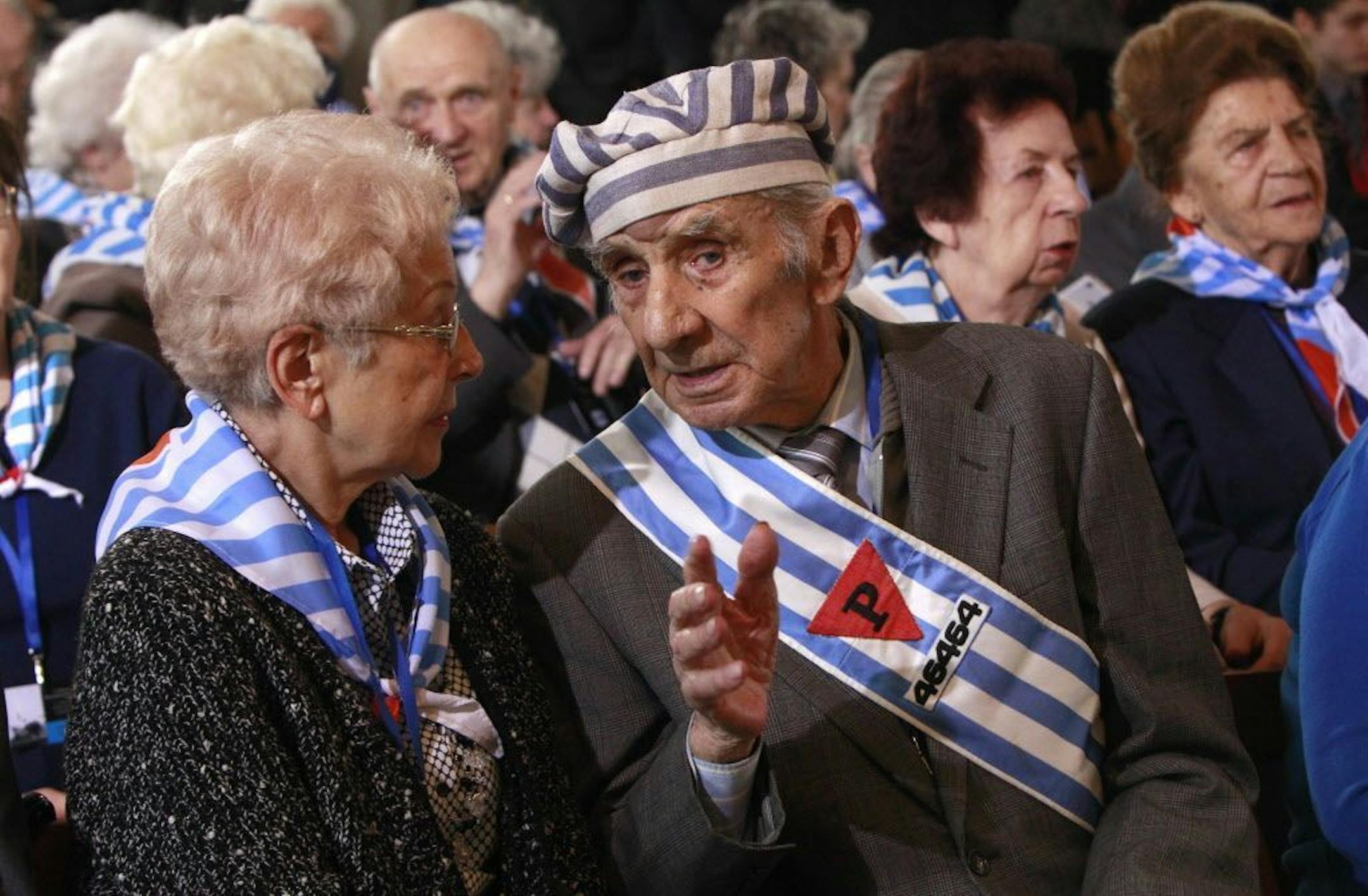 Holocaust survivors attend a ceremony at the former Auschwitz Nazi death camp in Oswiecim, Poland, Wednesday, Jan. 27, 2016, the 71st anniversary of the death camp's liberation by the Soviet Red Army in 1945.