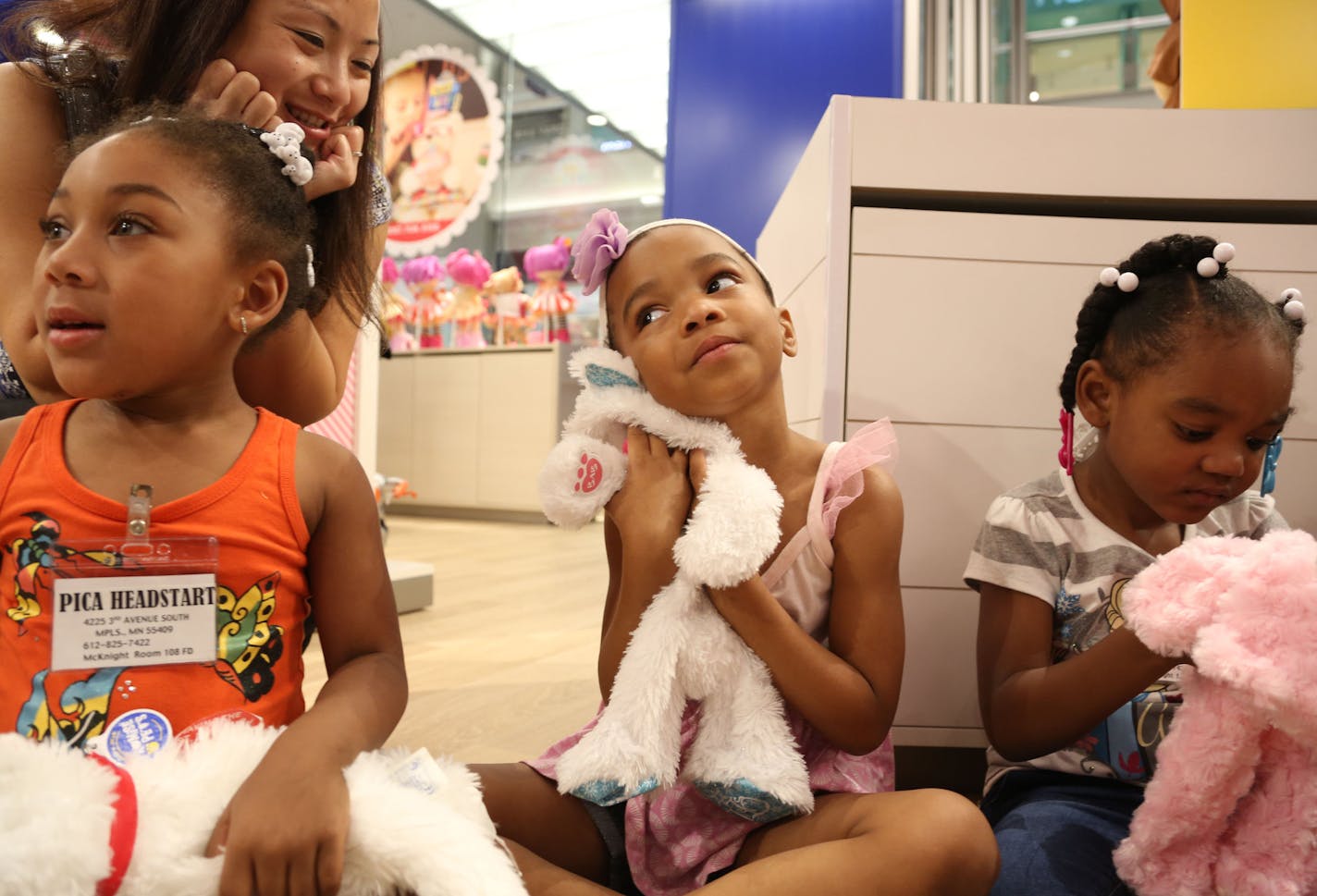 Shamajah Rogers, 4, hugged her stuffed cat as she waited for her animal to be stuffed along the rest of her group from PICA Head Start in Minneapolis at the newly redesigned Build-a-Bear at the Mall of America before its grand reopening. This group of kids were one of the first that day to have a bear made. ] (KYNDELL HARKNESS/STAR TRIBUNE) kyndell.harkness@startribune.com At the newly redesigned Build-a-Bear in Bloomington , Min., Tuesday September, 2015.