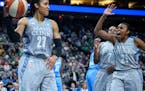 Renee Montgomery (21) and Jia Perkins (7) celebrated after Maya Moore (23) drew a shooting foul earlier this month.