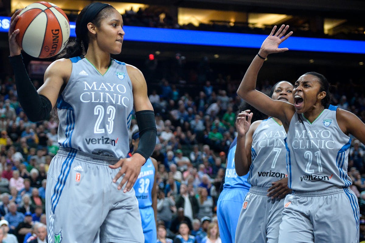 Renee Montgomery (21) and Jia Perkins (7) celebrated after Maya Moore (23) drew a shooting foul earlier this month.
