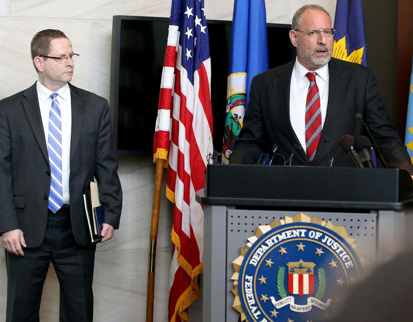 With FBI special agent Richard Thornton nearby, U.S. Attorney Andrew Luger announces that no federal criminal civil rights charges will be filed against the Minneapolis Police Department in the shooting of Jamar Clark during a press conference on Wednesday, June 1, 2016, at the local FBI headquarters in Brooklyn Center, Minn. (David Joles/Minneapolis Star Tribune/TNS) ORG XMIT: 1185544