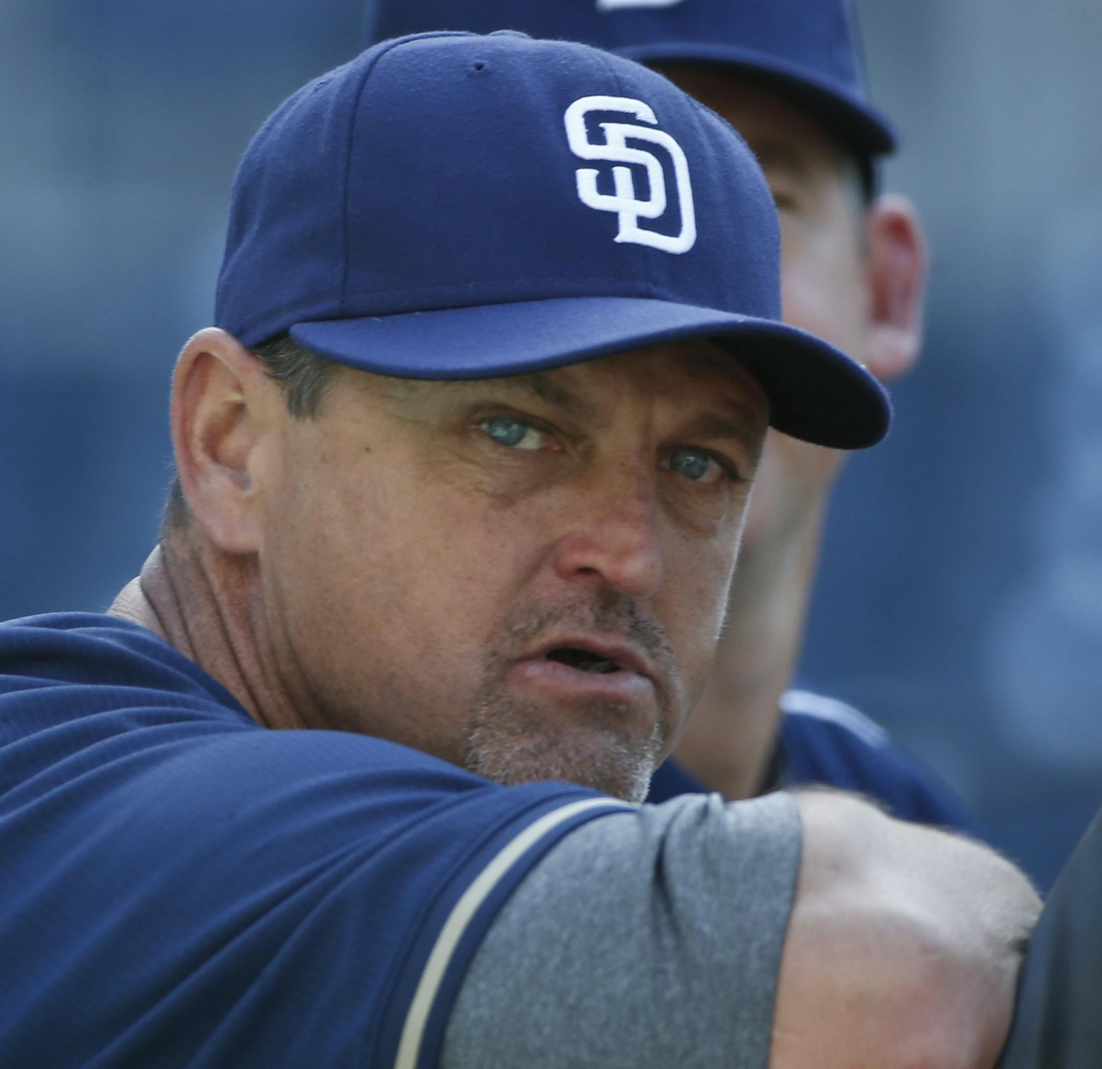 Former San Diego Padres closer Trevor Hoffman, who is now a special instructor to Padres' pitchers, leans on the batting cage prior to a baseball game against the Houston Astros, Monday, April 27, 2015, in San Diego. (AP Photo/Lenny Ignelzi) ORG XMIT: CALI102