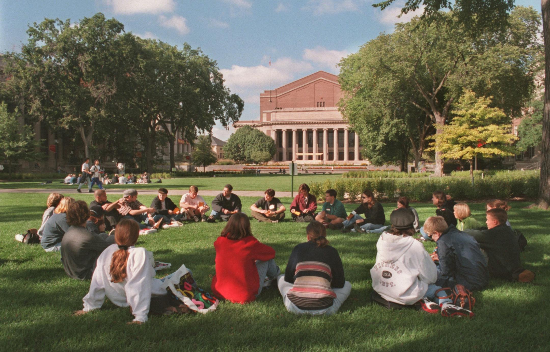 -- A group of new students attending an orientation program on campus sat in a circle on the mall. A few of the studernts in this group volunteeed to talk to the Star Tribune (Greg Pinney) about their impressions of the tenure system and its effect of education quality.