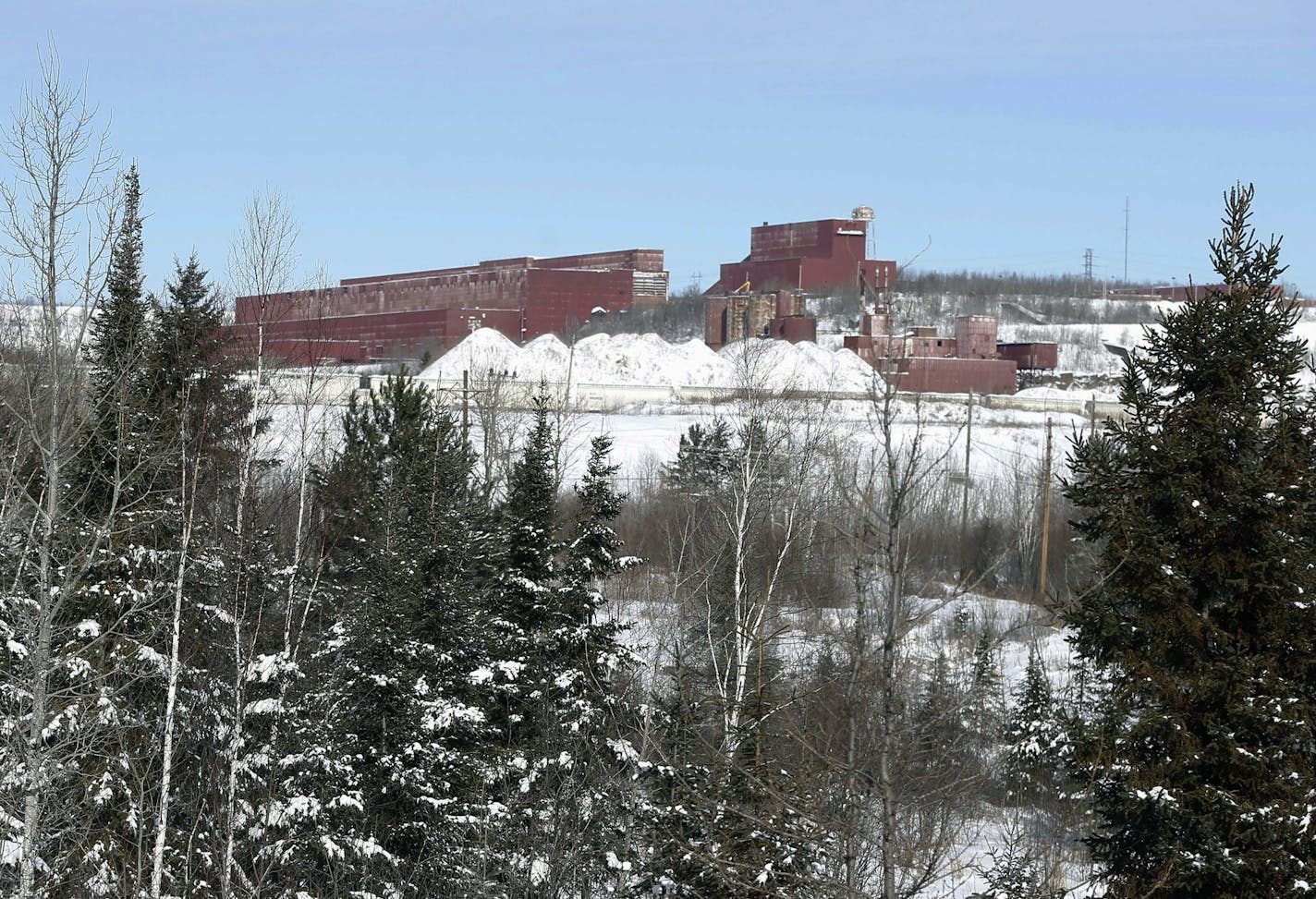 FILE - In this Feb. 10, 2016, file photo the closed LTV Steel taconite plant is seen near Hoyt Lakes, Minn. The prospect remains of returning the site, which was closed in 2000, to operation as part of Minnesota's first copper-nickel mine owned by PolyMet. U.S. Rep. Rick Nolan has introduced a bill to force completion of a land swap needed for the proposed PolyMet mine. (AP Photo/Jim Mone)