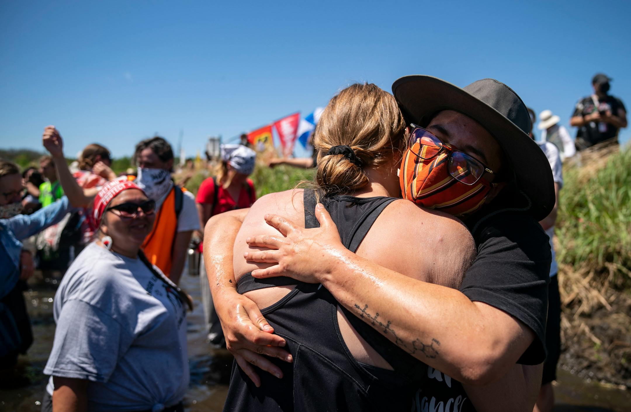 Celeste Skyfire Knight embraced a fellow demonstrator in the Mississippi River on Monday.