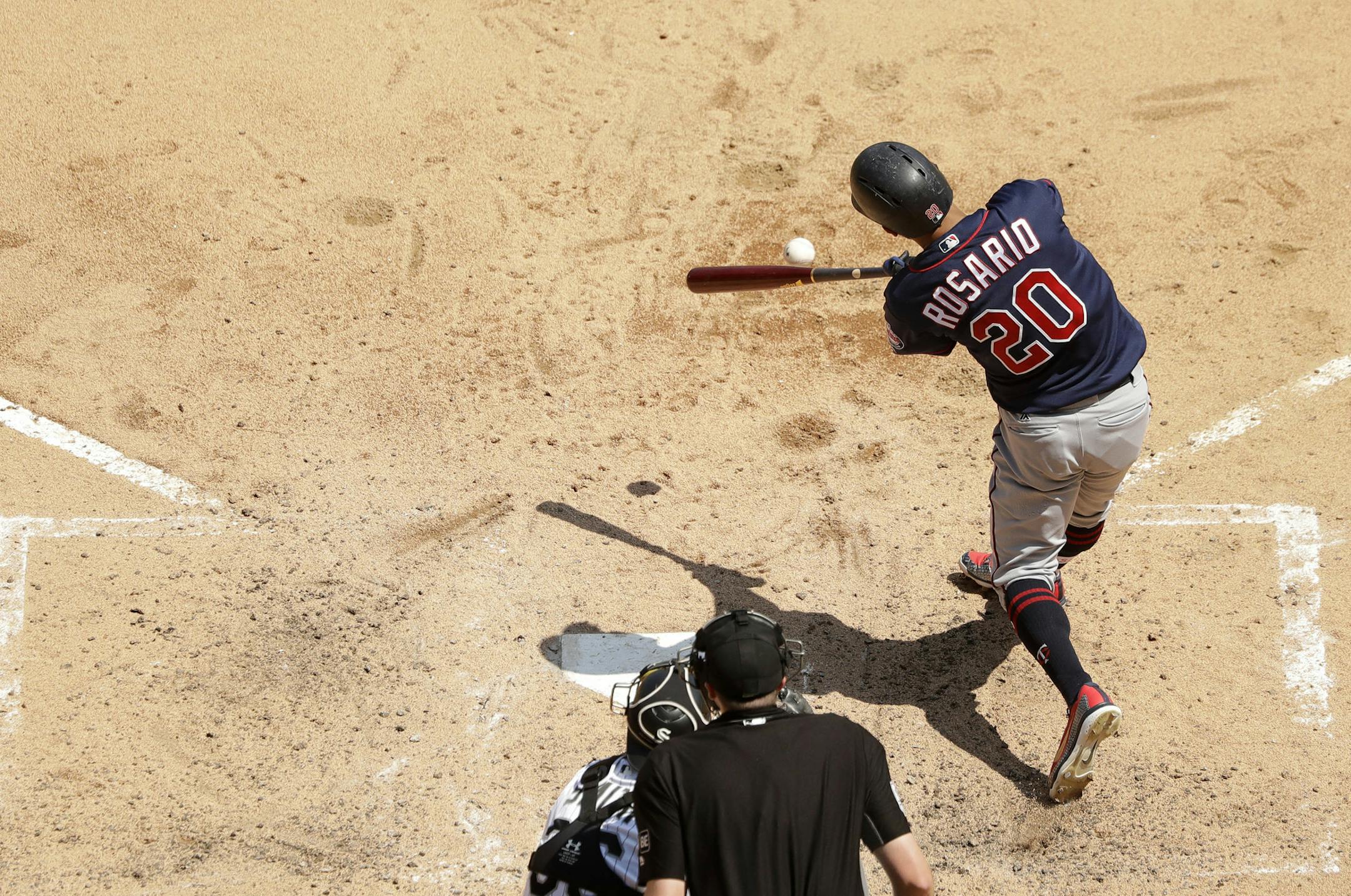 Minnesota Twins' Eddie Rosario singles off Chicago White Sox starting pitcher Lucas Giolito, the teams first hit of the game during the sixth inning of a baseball game Thursday, June 28, 2018, in Chicago. (AP Photo/Charles Rex Arbogast)
