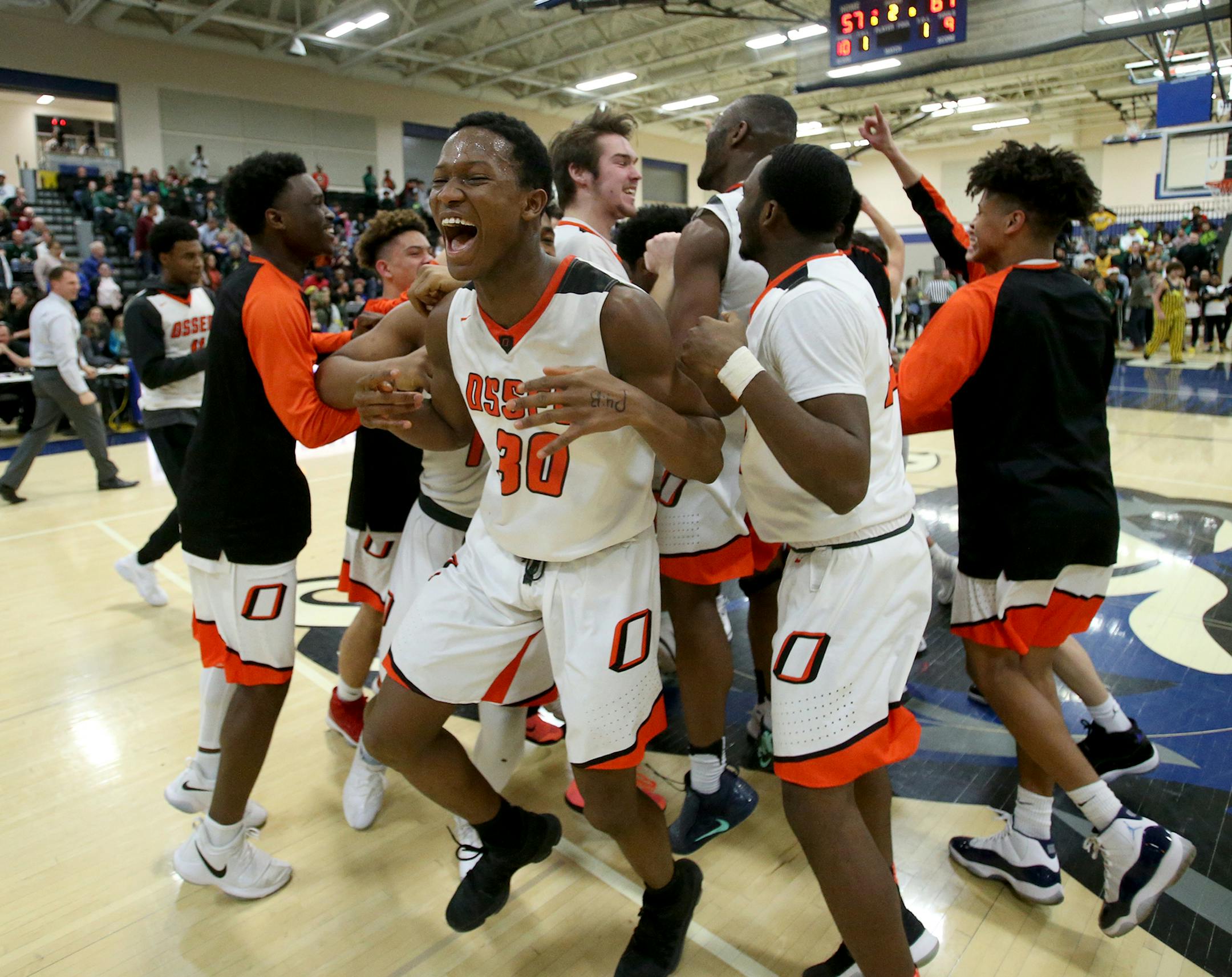 Osseo's Johnson Fallah (30) and teammates celebrate their 61-57 win over Park Center during the boys' basketball Class 4A, Section 5 championship at Rogers High, in Rogers, MN.] DAVID JOLES ï david.joles@startribune.com boys' basketball Class 4A, Section 5 championship, Park Center vs. Osseo at Rogers High, in Rogers, MN.
