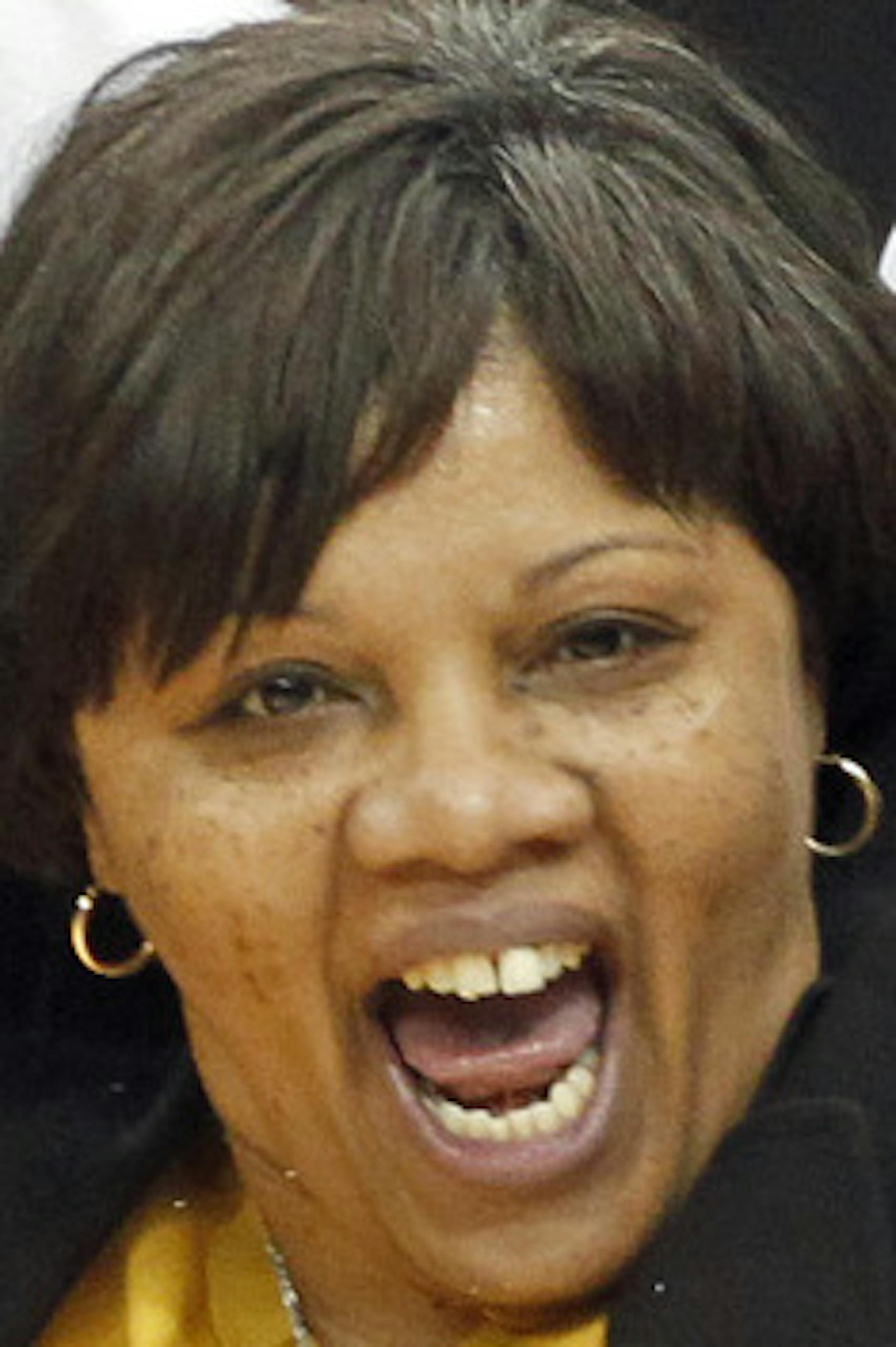 MARLIN LEVISON*mlevison@startribune.com GENERAL INFORMATION Hill -Murray Pioneers vs. DeLaSalle Islanders Class 3A Girls Basketball Championship Game. DeLaSalle won the game 63-43. THIS PHOTO: ]DeLaSalle head coach Faith Johnson Patterson, center led the victory cheers at the end of the game. ORG XMIT: MIN2015072417474458
