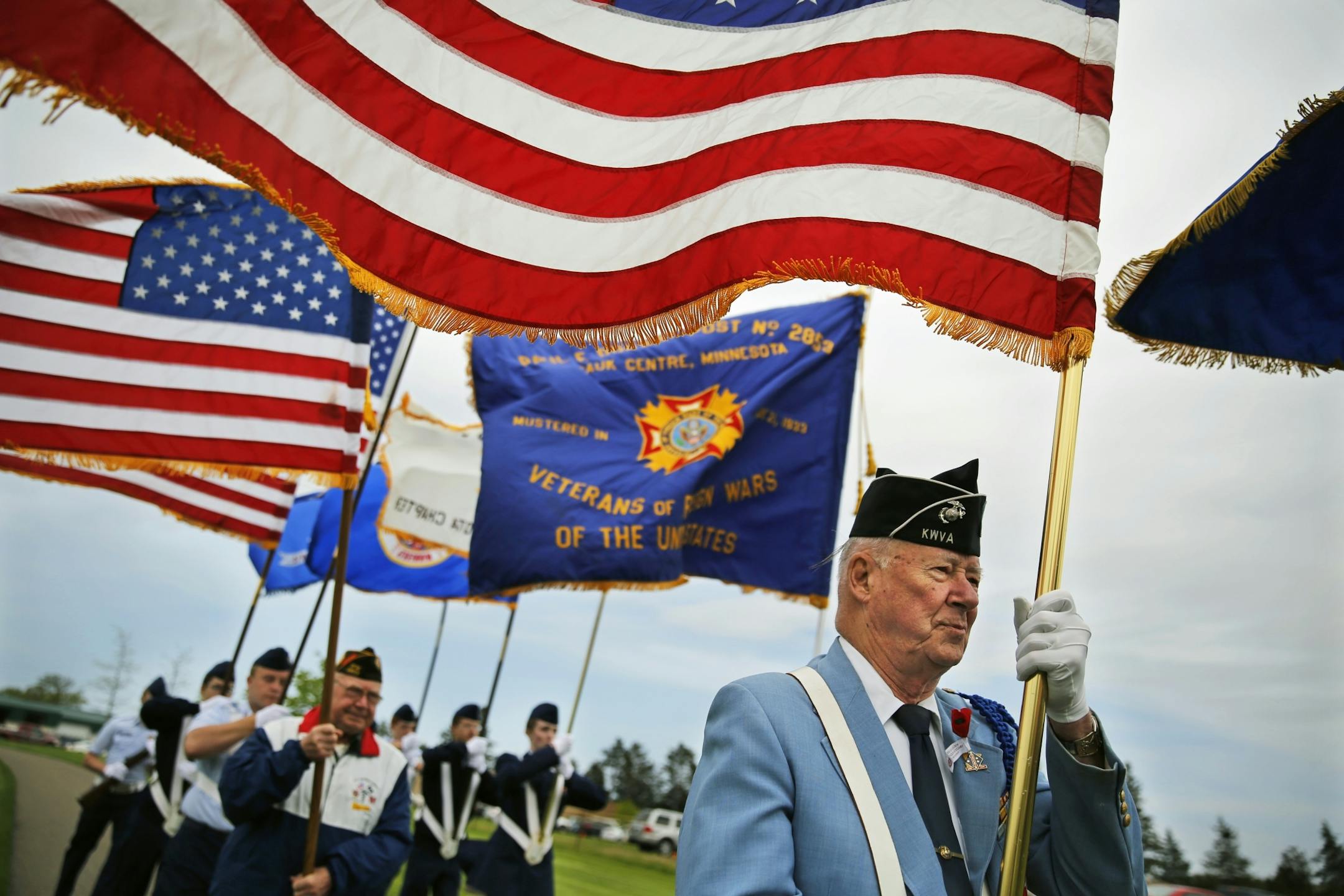 At the Memorial Day Service at the State Veterans Cemetery in Little Falls, Korean War veteran Bob Pellow,84, was a flag bearer in the strong winds that presided over the ceremonies.