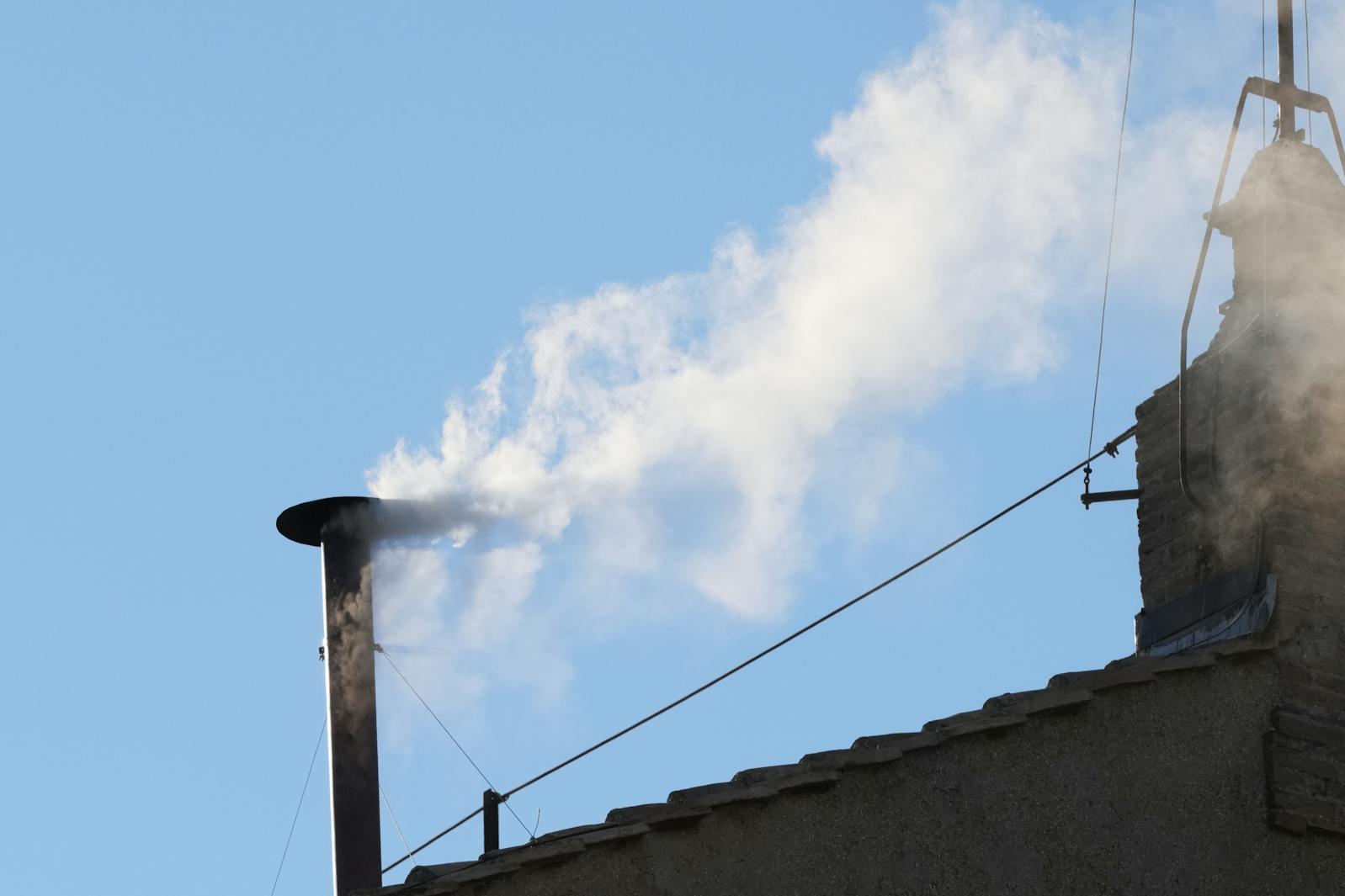White smoke billows from the chimney of the Sistine Chapel during the conclave to elect a new pope, at the Vatican, Thursday, May 8, 2025. 
