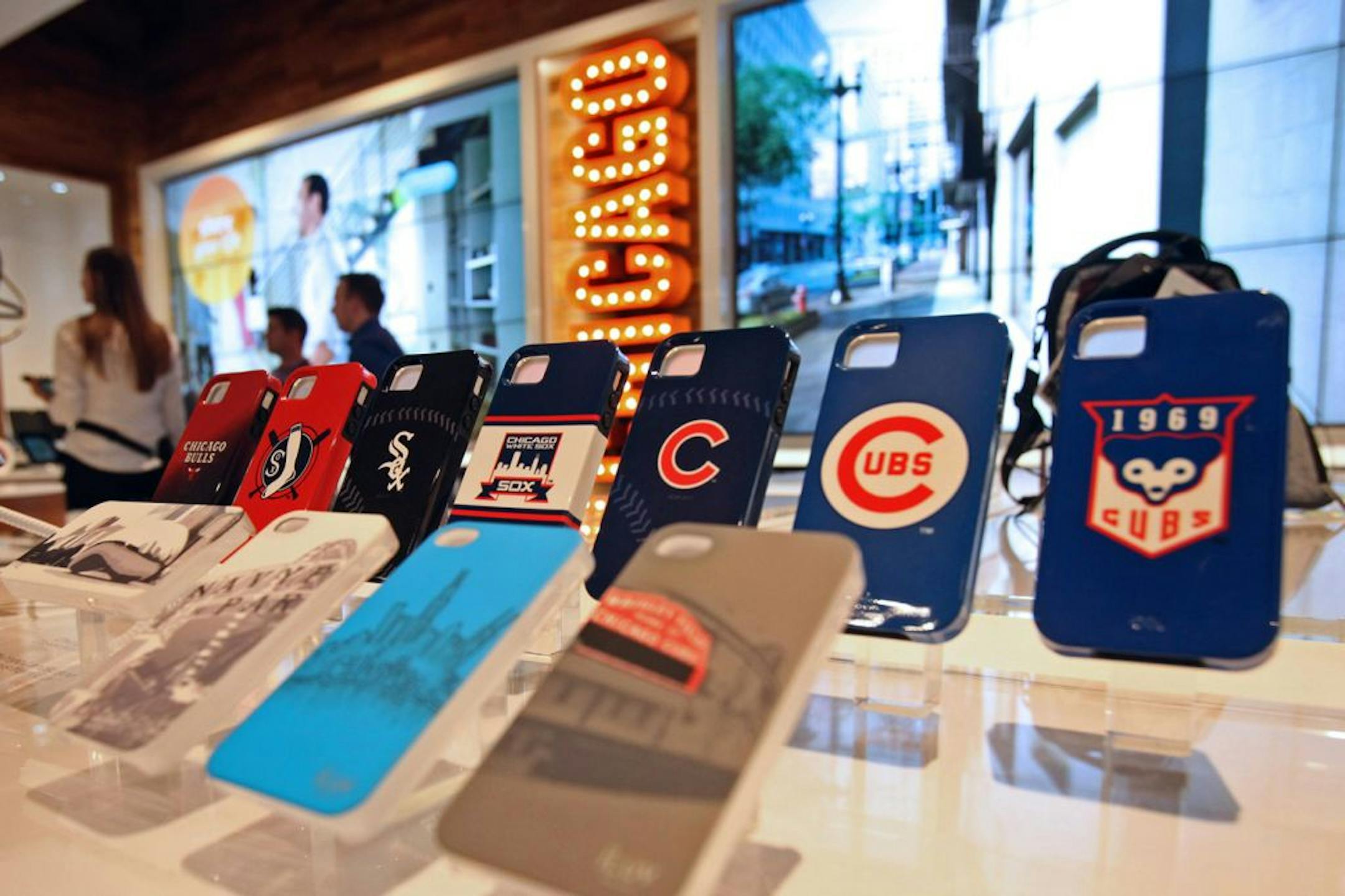Chicago-centric smartphone covers are displayed in the new AT&T Inc. store in Chicago. AT&T Inc. is refining its retail strategy with its first flagship store, a location on Chicago's Michigan Avenue, that goes beyond phones and tablets to show services such as fitness applications.