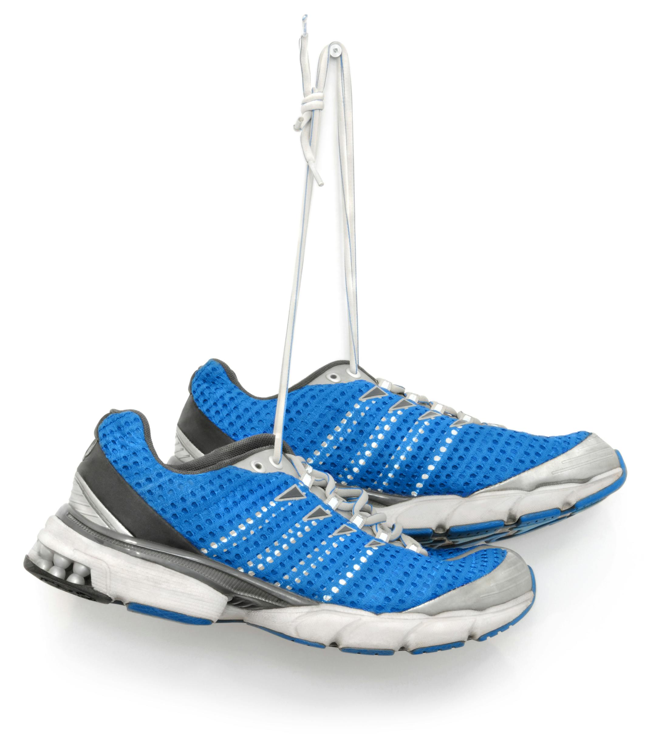 A pair of blue running shoes. Isolated on white. istock photo
