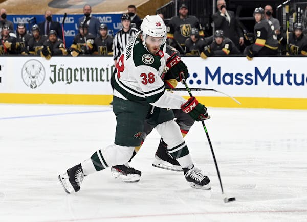 Minnesota Wild right wing Ryan Hartman (38) makes a shot on goal against the Vegas Golden Knights during the first period of Game 1 of a first-round N