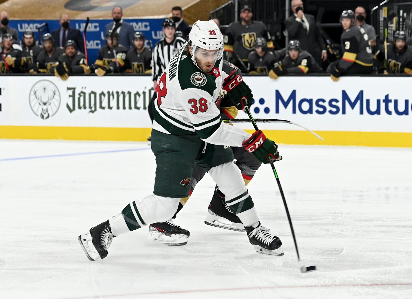 Minnesota Wild right wing Ryan Hartman (38) makes a shot on goal against the Vegas Golden Knights during the first period of Game 1 of a first-round NHL hockey playoff series Sunday, May 16, 2021, in Las Vegas. (AP Photo/David Becker)