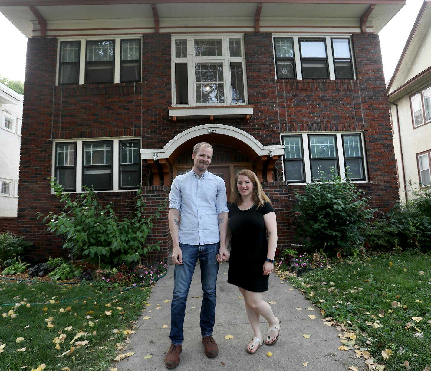 Matt Lewis and Natalie Wagner outside their condo in a Craftsmen style four plex, built in the 1920s, and seen Friday, Aug. 17, 2018, in Minneapolis, MN.] DAVID JOLES &#xef; david.joles@startribune.com An inside look at four plex life, as the city debates allowing them throughout the city.**Matt Lewis and Natalie Wagner,cq