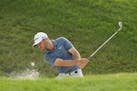 Matthew Wolff plays a shot from a bunker on the 12th hole during the second round of the 3M Open