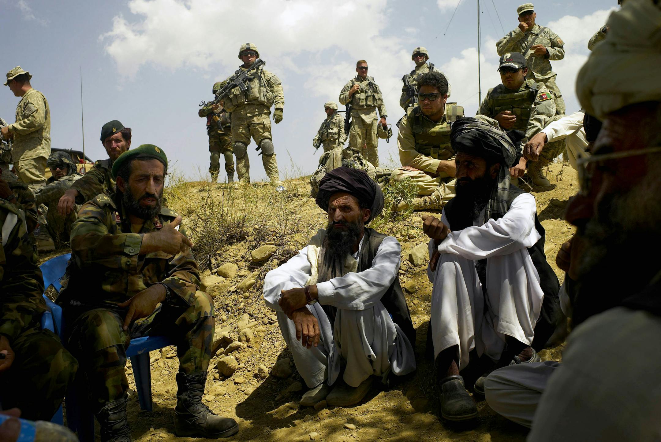 Tomas Munita/The New York Times
(NYT44) SHABAK VALLEY, Afghanistan -- Oct. 4, 2007 -- COMBAT-ANTHROPOLOGISTS-3 -- U.S. soldiers look on as Afghan Army troops meet with tribal elders trying to resolve a land dispute in Shabak Valley, Afghanistan, on Sept. 3, 2007. Social scientists are helping the American military understand tribal relations. (Tomas Munita/The New York Times)