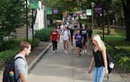 University of St. Thomas students walked to classes in 2019. UST will begin gradually opening next week and reopen to students for fall semester.