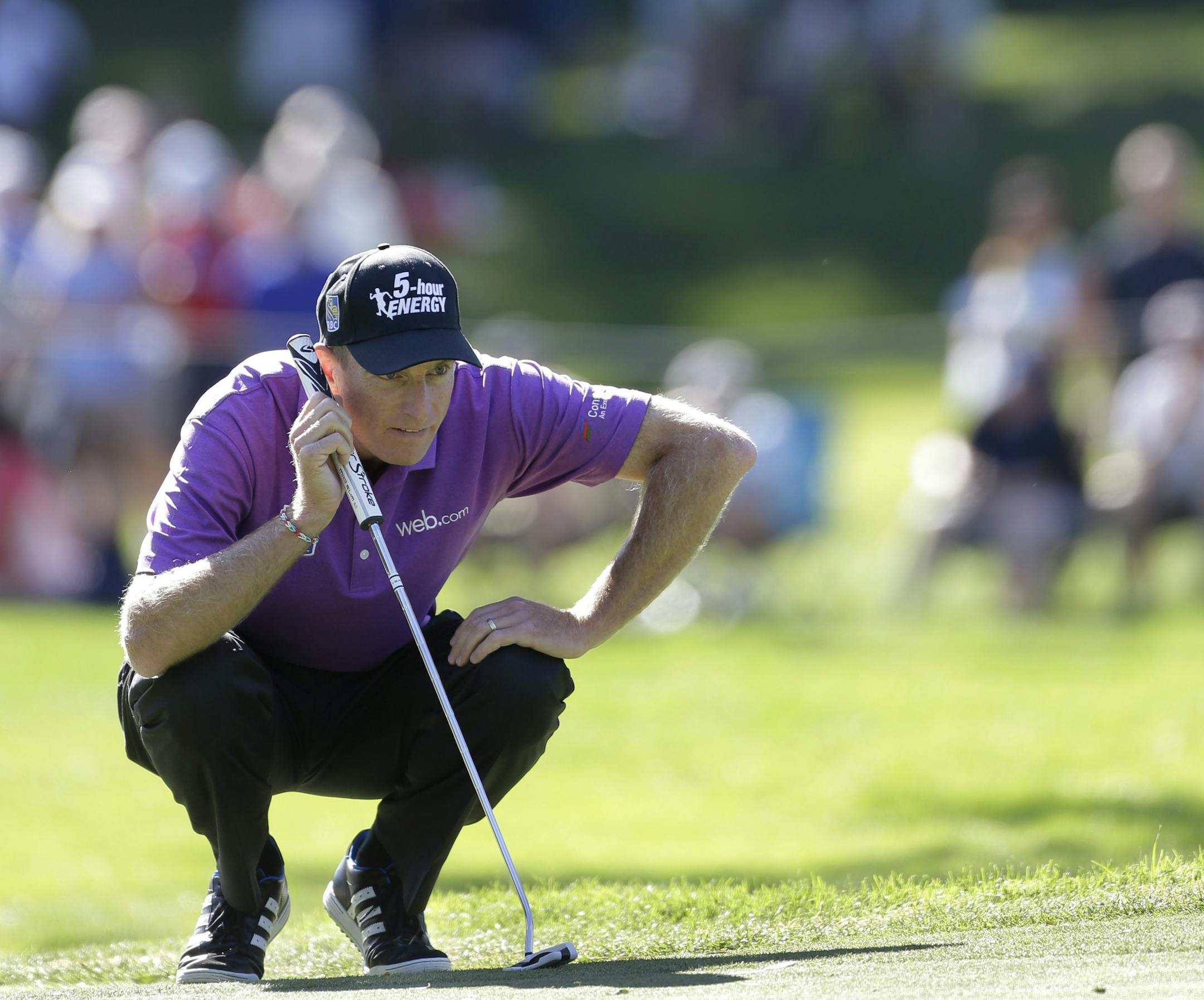 Jim Furyk lines up a putt on the 14th hole during the third round of the PGA Championship golf tournament at Oak Hill Country Club, Saturday, Aug. 10, 2013, in Pittsford, N.Y. (AP Photo/Julio Cortez)