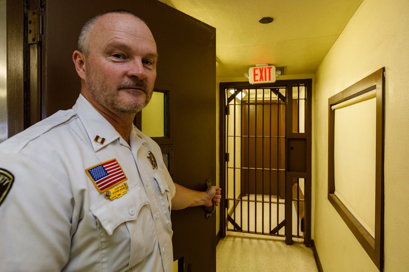 Capt. Steven Buswell showed a narrow passageway that wouldn't be allowed under existing standards. The county is scrambling to get a new law enforcement center built before the old one is closed by state order in 2021.