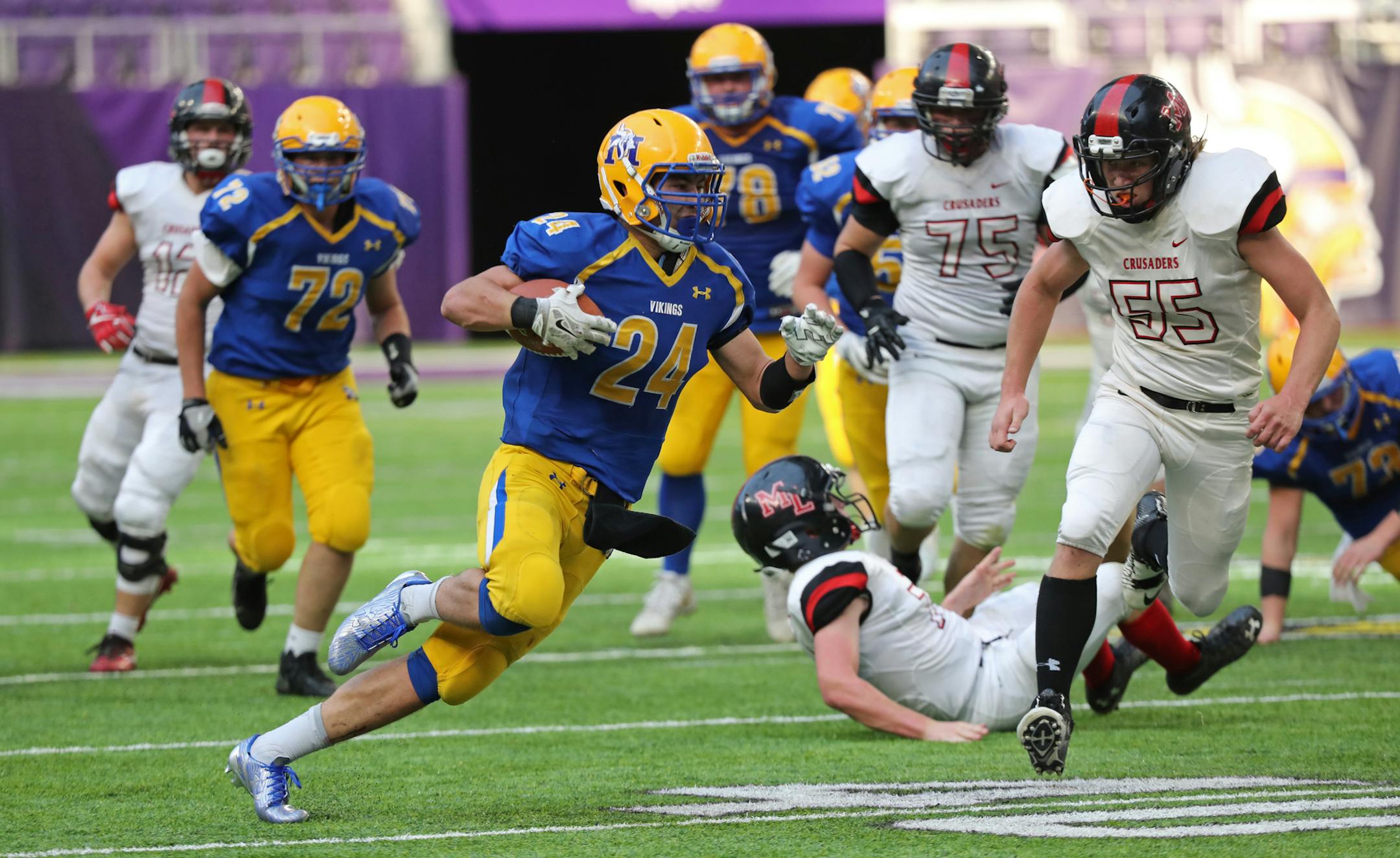 Minneota running back Isaac Hennen ran for a first down. ] Shari L. Gross ï shari.gross@startribune.com Minneota led Mayer Lutheran 41-0 at the half in the Class 1A PrepBowl semifinal at U.S. Bank Stadium on Saturday, Nov. 18, 2017