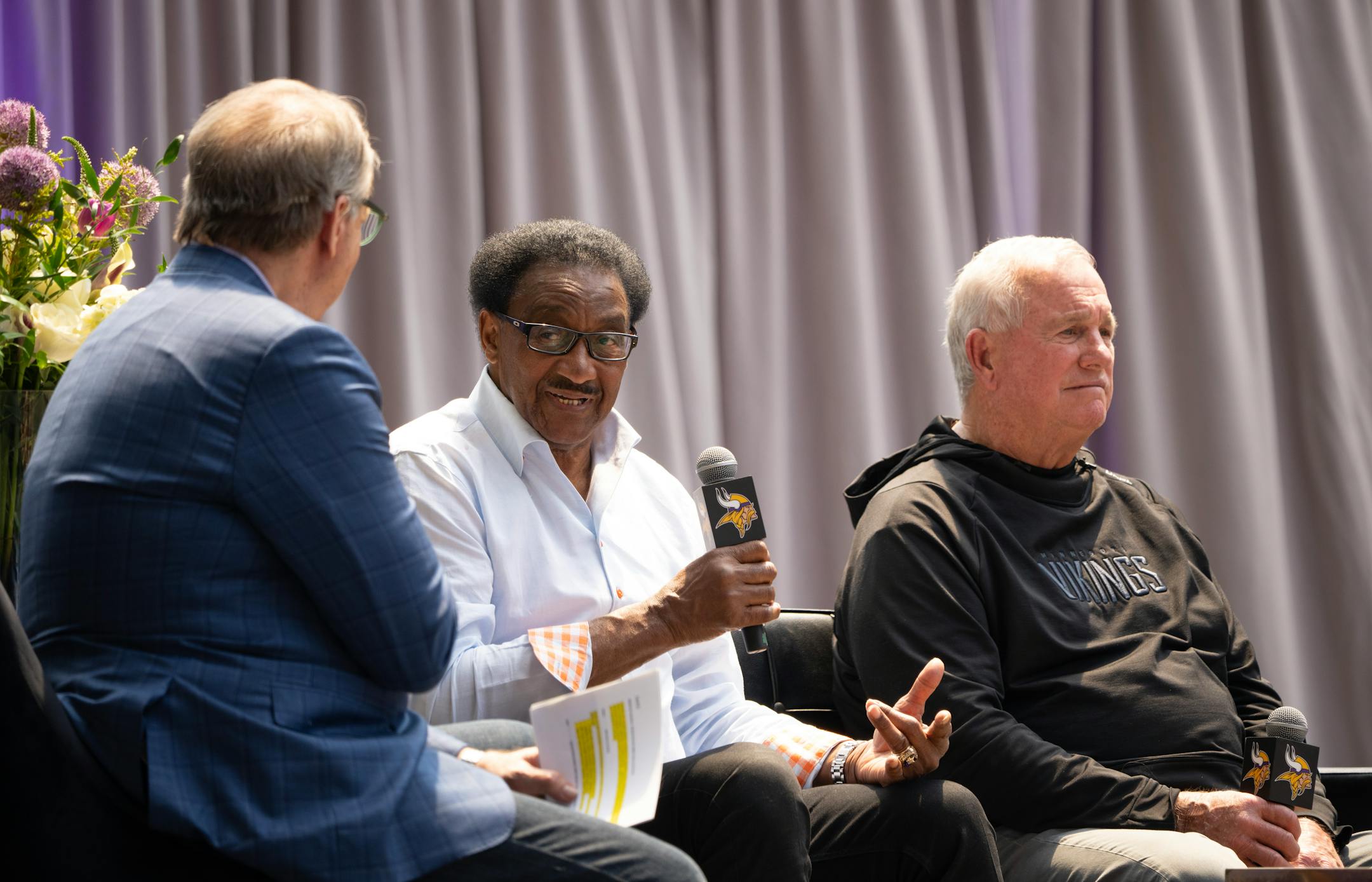 Former Vikings player Chuck Foreman remembered head coach Bud Grant during a discussion with Mark Rosen, left, and Stu Voigt.
