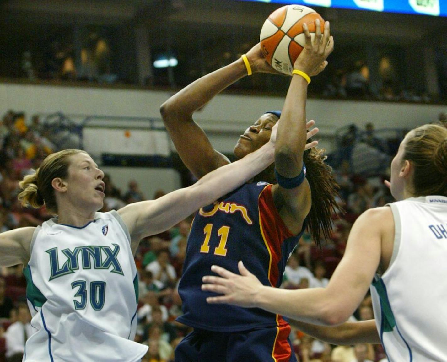 Katie Smith defends during a game in 2004. The opposing player is Taj McWilliams-Franklin, who ended her playing career in Minnesota.