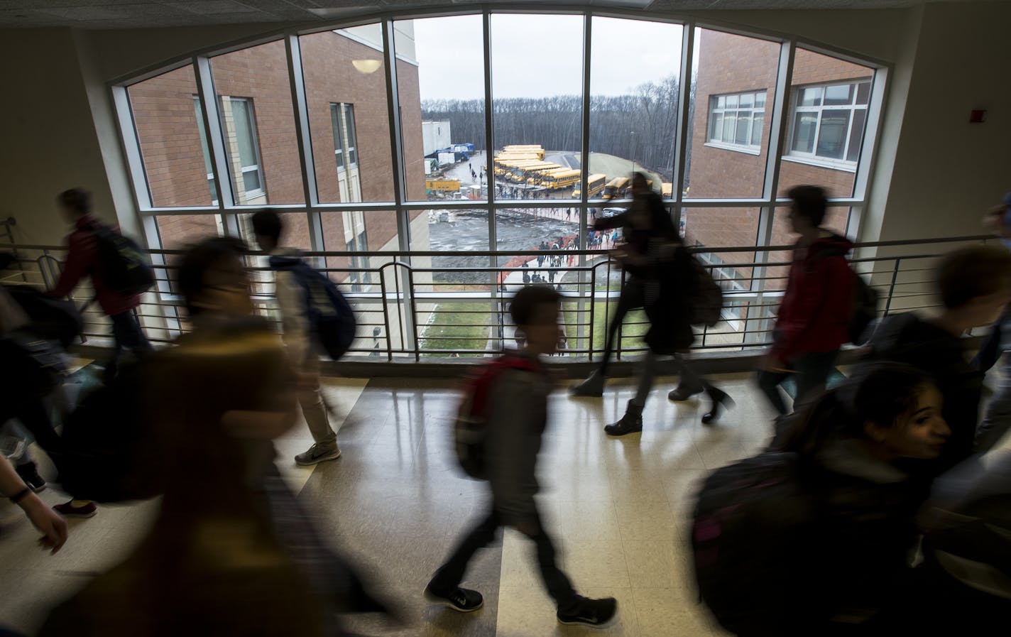 Students made their way through an upper level hallway at the end of the school day Tuesday. ] (AARON LAVINSKY/STAR TRIBUNE) aaron.lavinsky@startribune.com Wayzata public schools became the latest Minnesota district to "flip" start times so that high school students can sleep later and grade-schoolers get on the bus earlier. The vote came at an emotional meeting that reflected divisions among parents over academic quality, family time and busy working parents. Advocates say these flips cater to