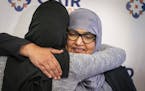 Aida Shyef Al-Kadi, right, of St. Louis Park, got a hug from Asma Mohammed, advocacy director at Reviving the Islamic Sisterhood for Empowerment, afte