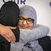 Aida Shyef Al-Kadi, right, of St. Louis Park, got a hug from Asma Mohammed, advocacy director at Reviving the Islamic Sisterhood for Empowerment, afte