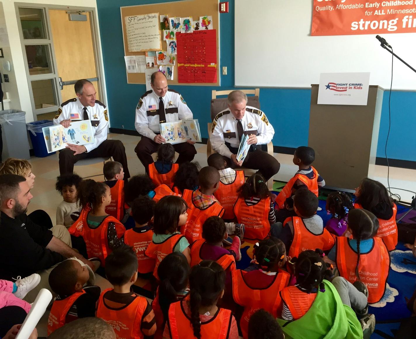 The Dakota, Hennepin and Ramsey county sheriffs read Wednesday to preschoolers at YWCA of Minneapolis in Midtown, calling for more state funding for early learning programs.