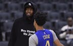 Golden State Warriors Kevin Durant, left, talks with teammate Stephen Curry during basketball practice at the NBA Finals in Toronto, Saturday, June 1,