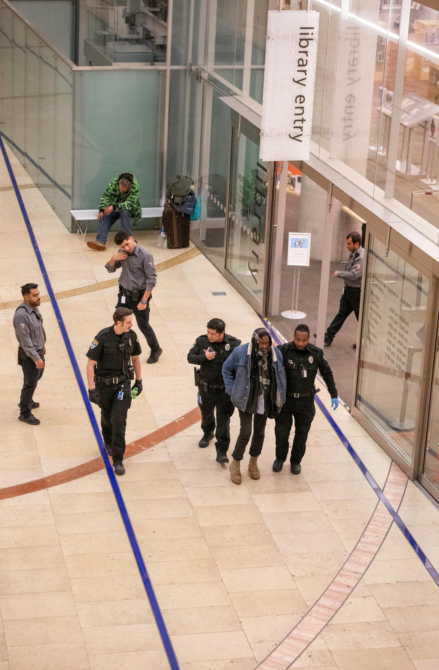 Security officer escorted a man from the Central Library Thursday afternoon January,4, 2024 in, Minneapolis, Minn. ] JERRY HOLT • jerry.holt@startribune.com