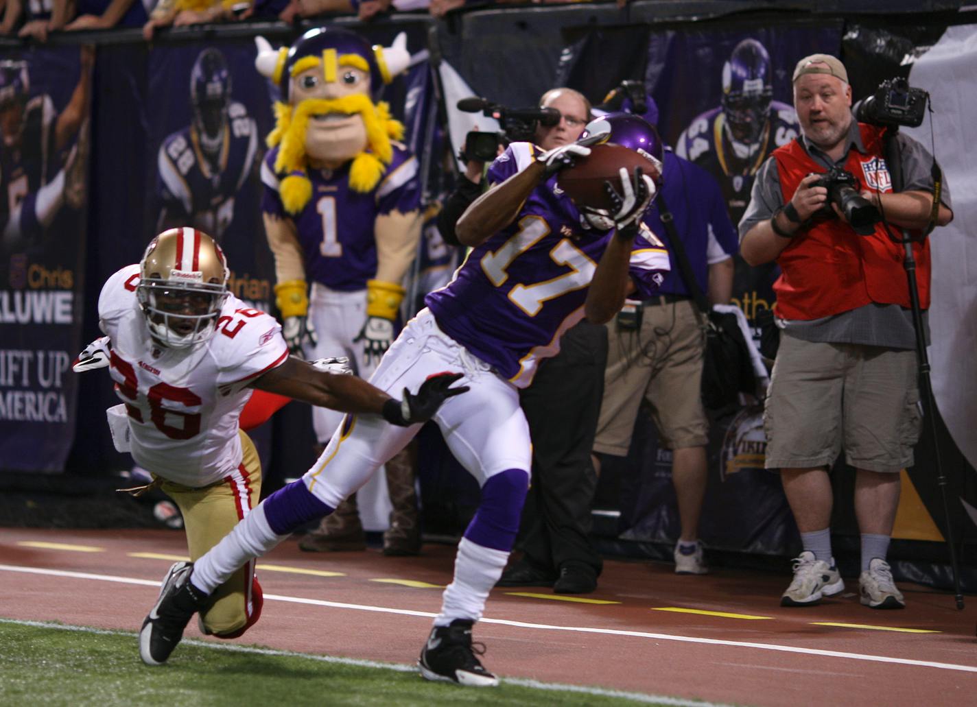 Greg Lewis landed with both feet in the end zone after grabbing a 32 yard touchdown pass from Brett Favre to win the game for the Vikings