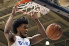 FILE - In this Jan. 27, 2018, file photo, Duke's Marvin Bagley III (35) dunks the ball during the first half of an NCAA college basketball game agains