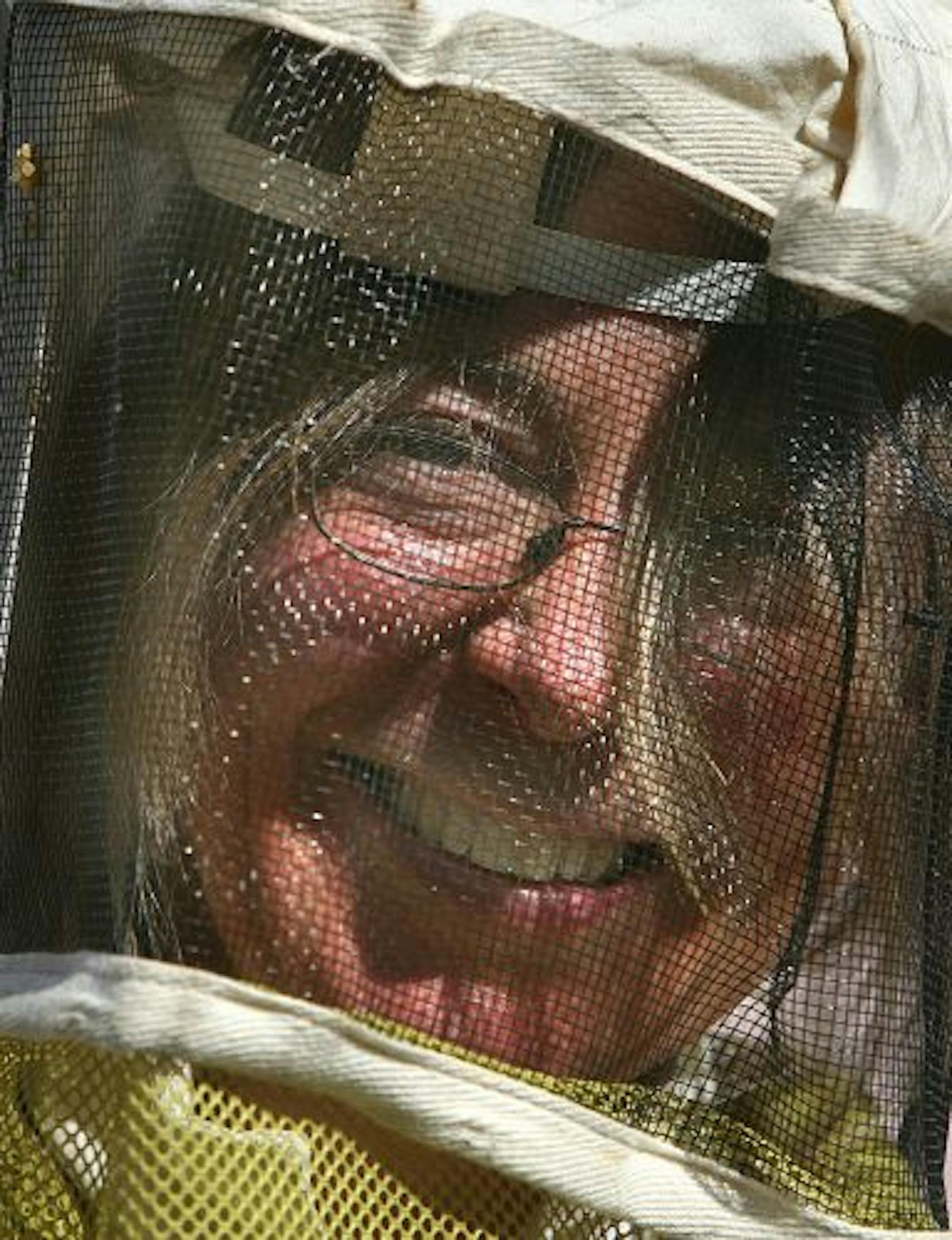 JIM GEHRZ � jgehrz@startribune.comMinneapolis/April 15, 2009/3:00PMBeekeeper Elsie Kyllo tended to a honey bee hive she keeps at the home of a friend in south Minneapolis. Kyllo sad that she was looking for the queen, but was unable to locate her. She said the bees might be affected by mites. She was also providing some food in the form of pollen cakes, to give the bees protein.