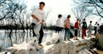 April 7, 1989 These students were excused from classes at Shanley High School In Fargo, N.D., Thursday to help place sandbags along the Red River. Rad