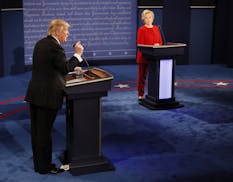 Republican presidential nominee Donald Trump gestures during the presidential debate with Democratic presidential nominee Hillary Clinton at Hofstra U