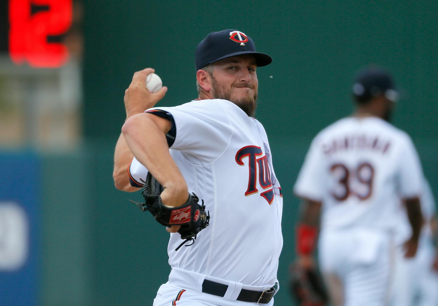 Glen Perkins throws a warm up pitch in the seventh inning of a spring training baseball game against the Tampa Bay Rays last March. Perkins was limited last season because of a torn labrum.