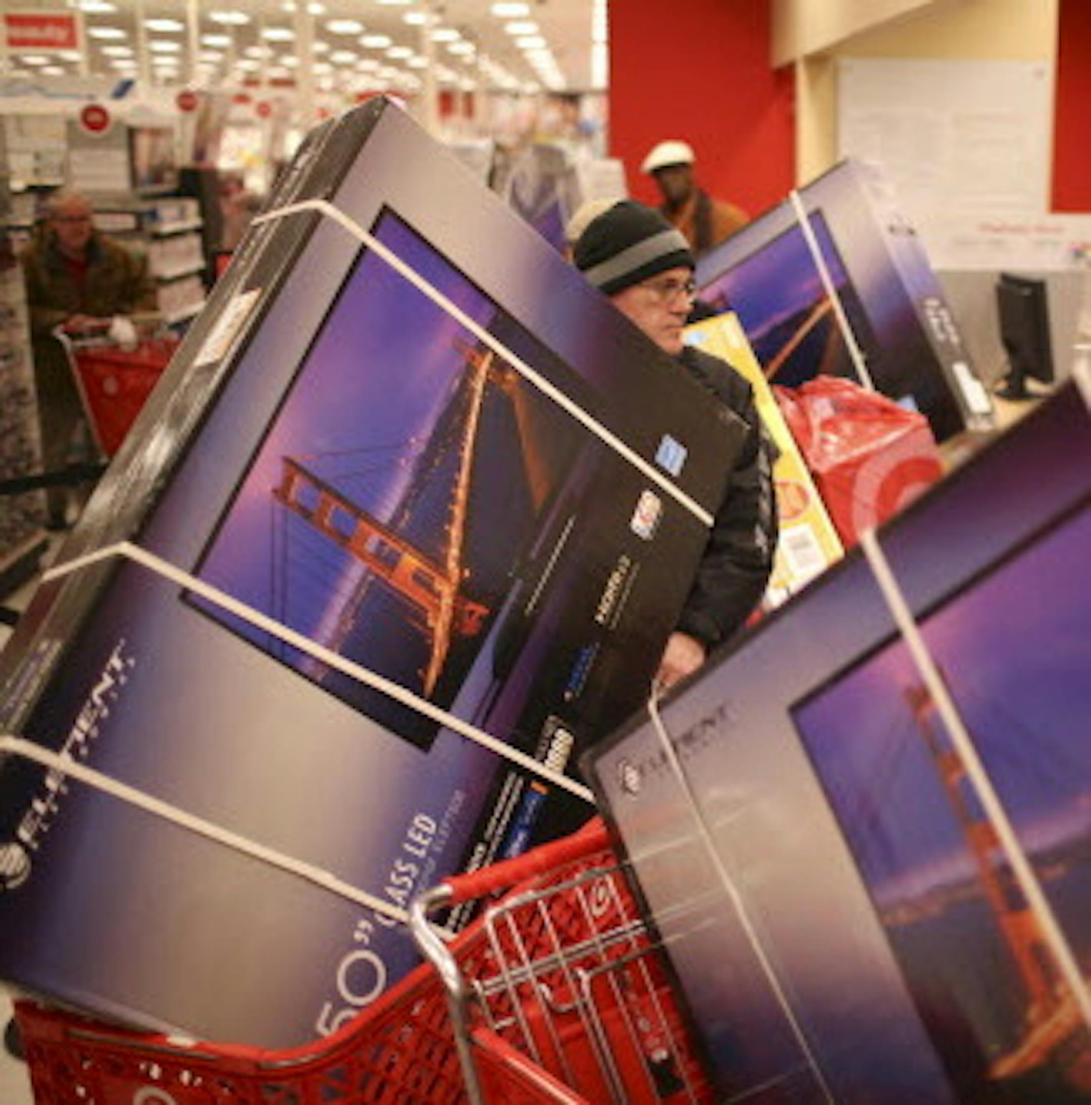 Hundreds of early bargain hunters were in line to enter the Target store at Ridgedale in Minnetonka when it opened at 8 p.m. Thursday night, November 28, 2013. The pharmacy registers were devoted to checking out shoppers with televisions sets that were a feature of the Thanksgiving Day sale. ] JEFF WHEELER ‚Ä¢ jeff.wheeler@startribune.com