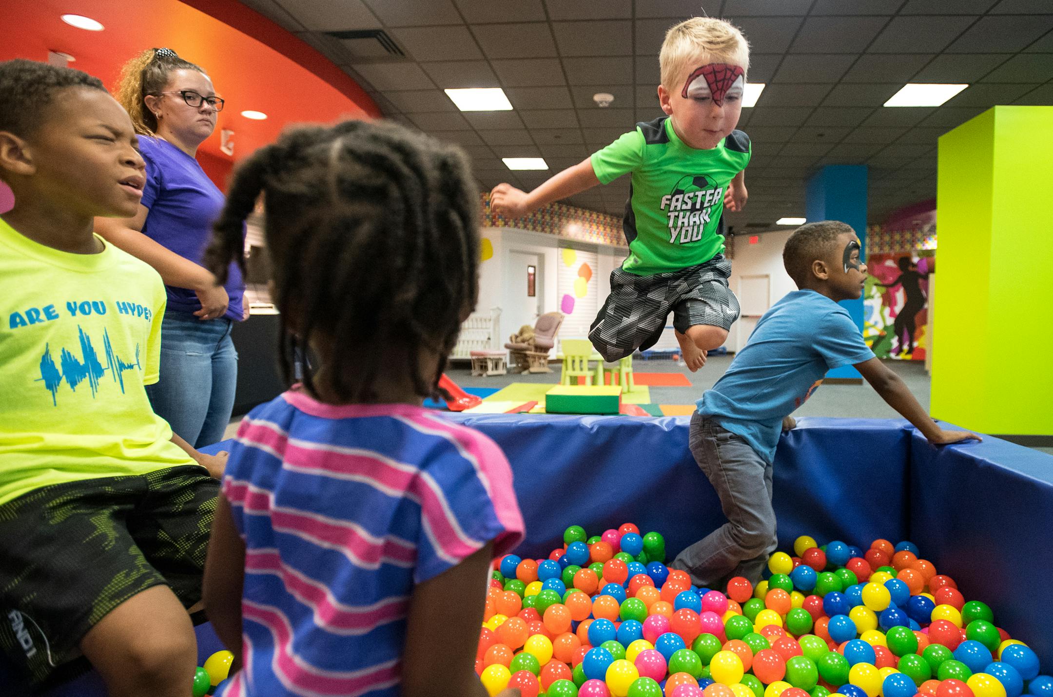 Connor Deibel (cq), 3, leapt into a ball pit while playing with other children during the grand opening celebration of "Drop 'n Shop" Friday at Mall of America. ] (AARON LAVINSKY/STAR TRIBUNE) aaron.lavinsky@startribune.com A new child care drop-off service called Drop 'n Shop at the Mall of America is opening. It will give parents an option for more stress-free shopping without the kids. We photograph the grand opening celebration on Friday, July 15, 2016 at Mall of America.