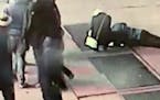 In this Nov. 30, 2018 image taken from surveillance video provided by the New York City Police Department, a man tries to see the engagement ring that